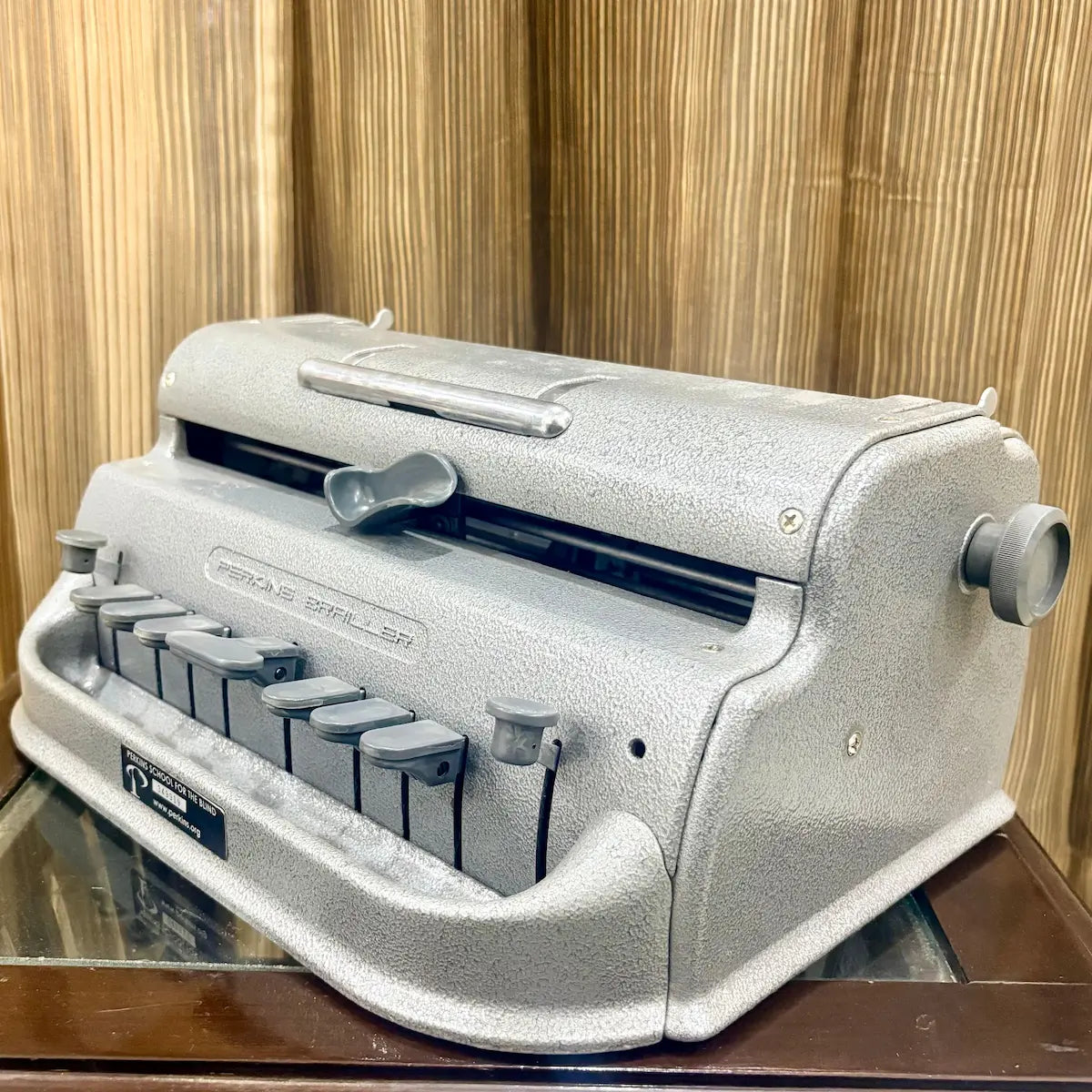 Perkins Braille Typewriter displayed in its rare blue wooden carrying case, a distinctive find at RR Typewriter Mart across India.