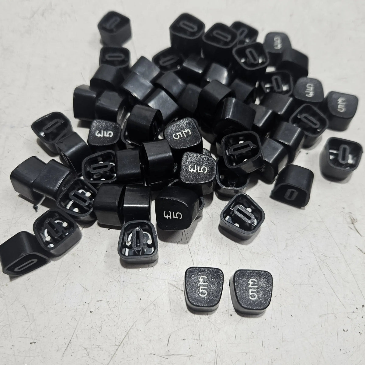 Loose number 5 keytops for Godrej typewriters arranged together, typing machine spare parts for servicing projects