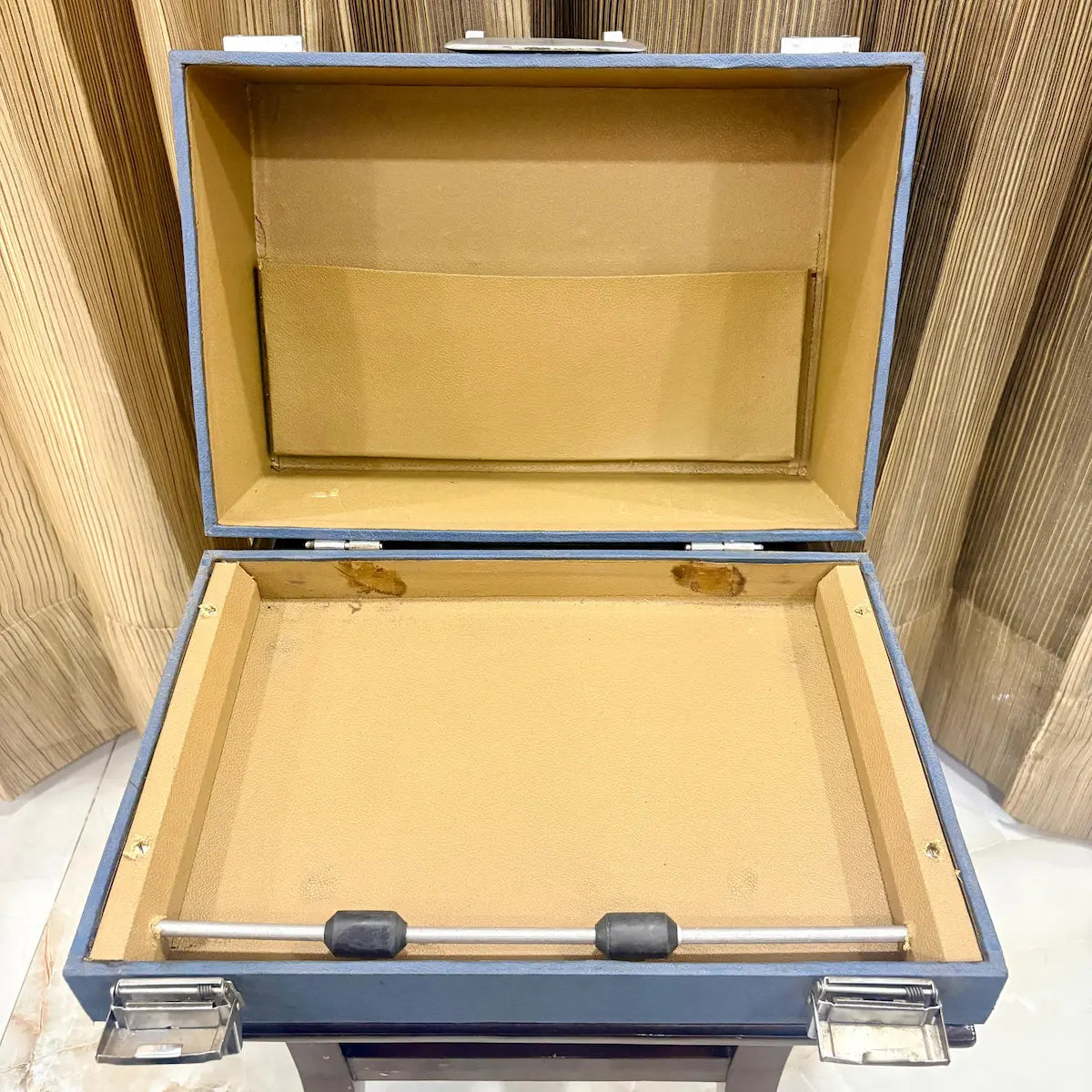 Open wooden case displaying the Perkins Brailler, its interior and machine at RR Typewriter Mart for Braille users across India today.