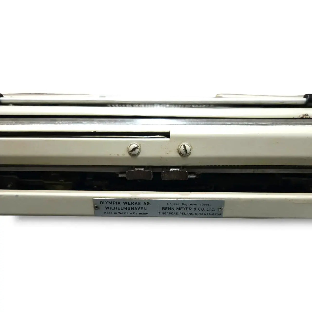 Rear panel of Olympia portable typewriter showing West Germany imported typing machine build quality