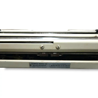 Rear panel of Olympia portable typewriter showing West Germany imported typing machine build quality