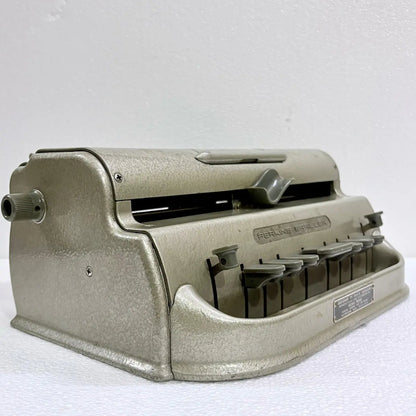 Perkins Braille Typewriter for Braille literacy, featuring a classic metal body and original gold-like finish from RR Typewriter Mart