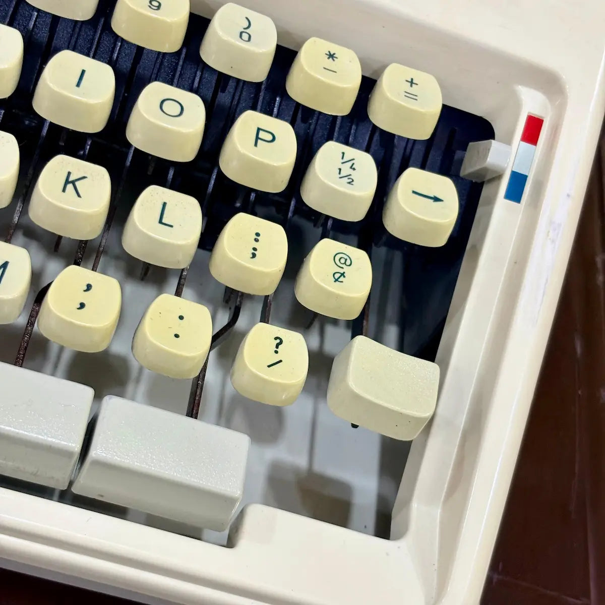 Royal Junior manual English typewriter close-up of cream QWERTY keys and red controls, from RR Typewriter Mart.