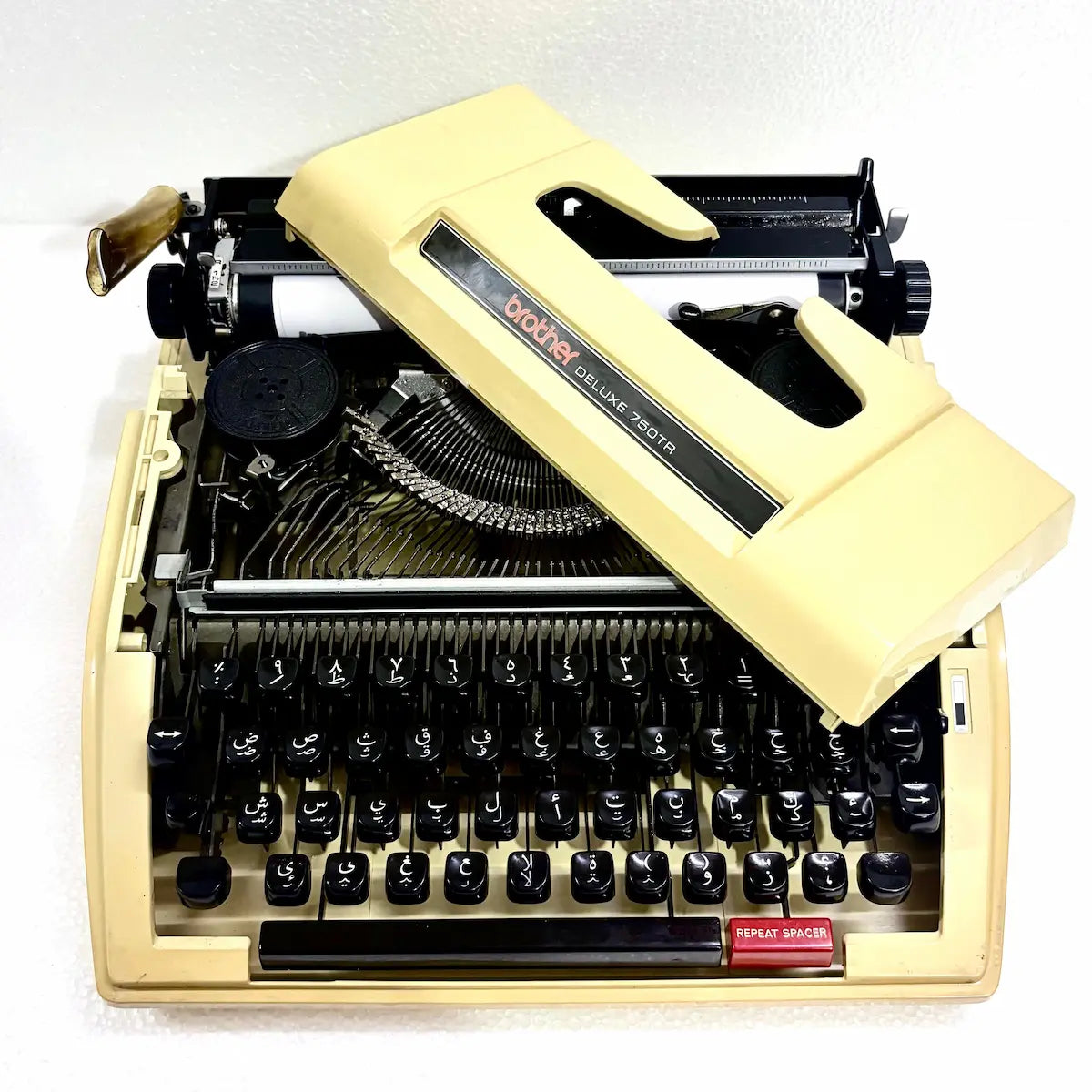 Brother 750TR Arabic typewriter for collectors, featuring Arabic keyboard, cream casing and original hard carrying case in India now