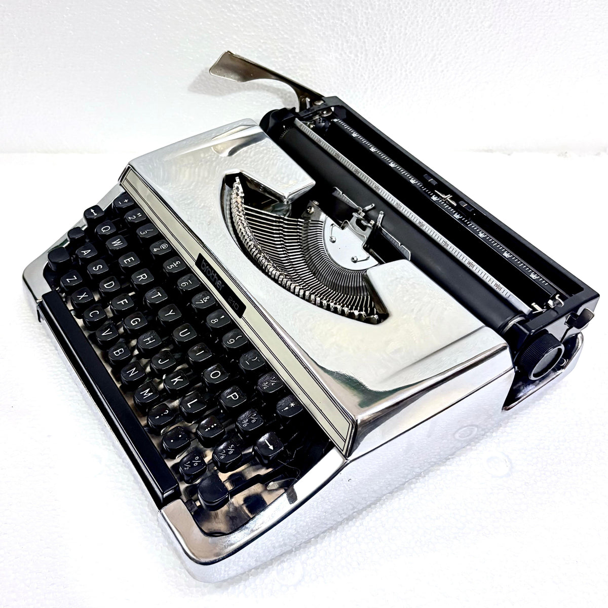 Brother 210 custom chrome typewriter with black keys and mechanical typing system from RR Typewriter Mart