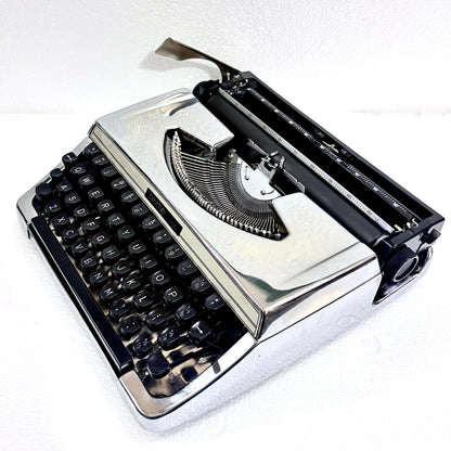 Brother 210 custom chrome typewriter with black keys and mechanical typing system from RR Typewriter Mart