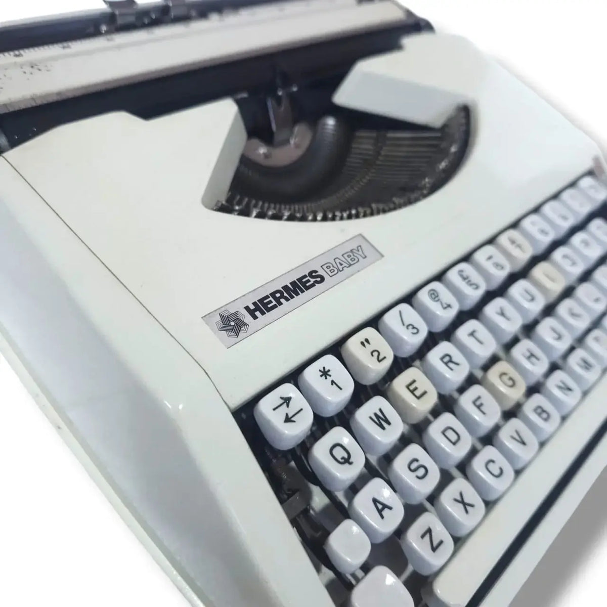 Rear carriage view Hermes Baby typing machine, manual English Typewriter with polished metal finish