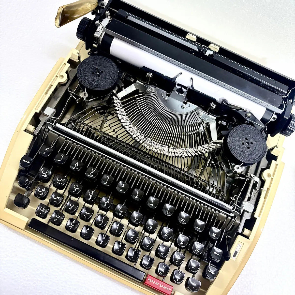 Brother Deluxe 750TR Arabic typewriter with Arabic script keys, compact portable body and restored mechanical construction for India