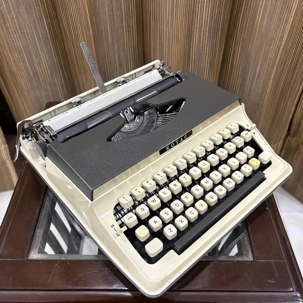 Vintage Japanese portable typewriter with original grey and white body, manual keyboard and distinctive Kovac styling | RR Typewriter Mart