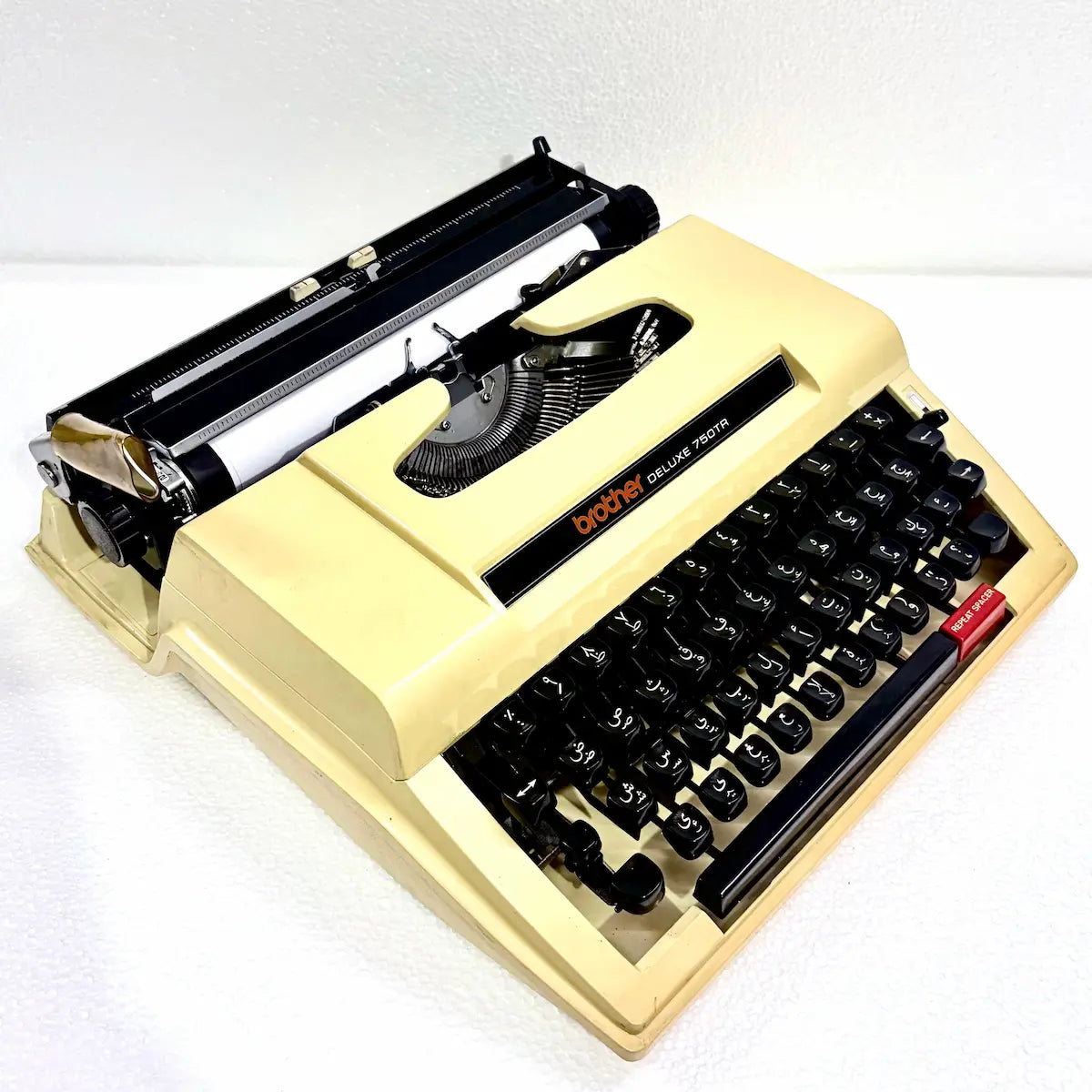 Arabic Brother 750TR portable typewriter showing full keyboard, cream casing and mechanical design for Arabic writing and collectors