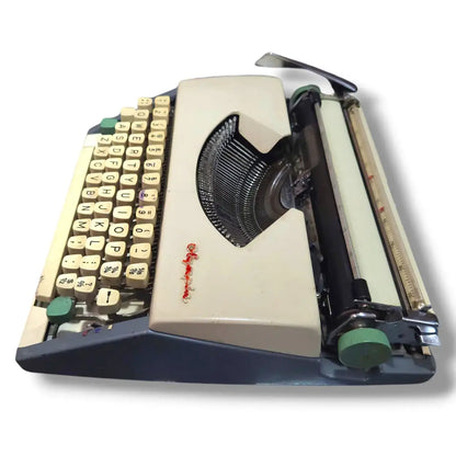 Top angle Olympia Typewriter portable typing machine with classic keyboard and imported metal frame