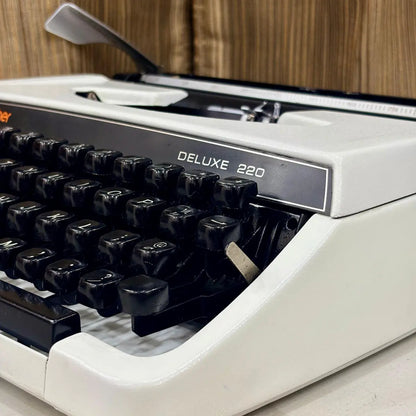 Pearl White Brother Deluxe 220 mechanical typewriter, portable QWERTY typewriter from RR Typewriter Mart for writers and collectors