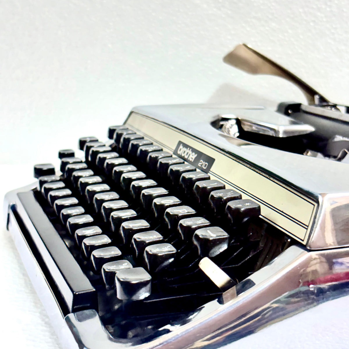 Brother 210 chrome manual typewriter price and details from RR Typewriter Mart India for collectors and writers