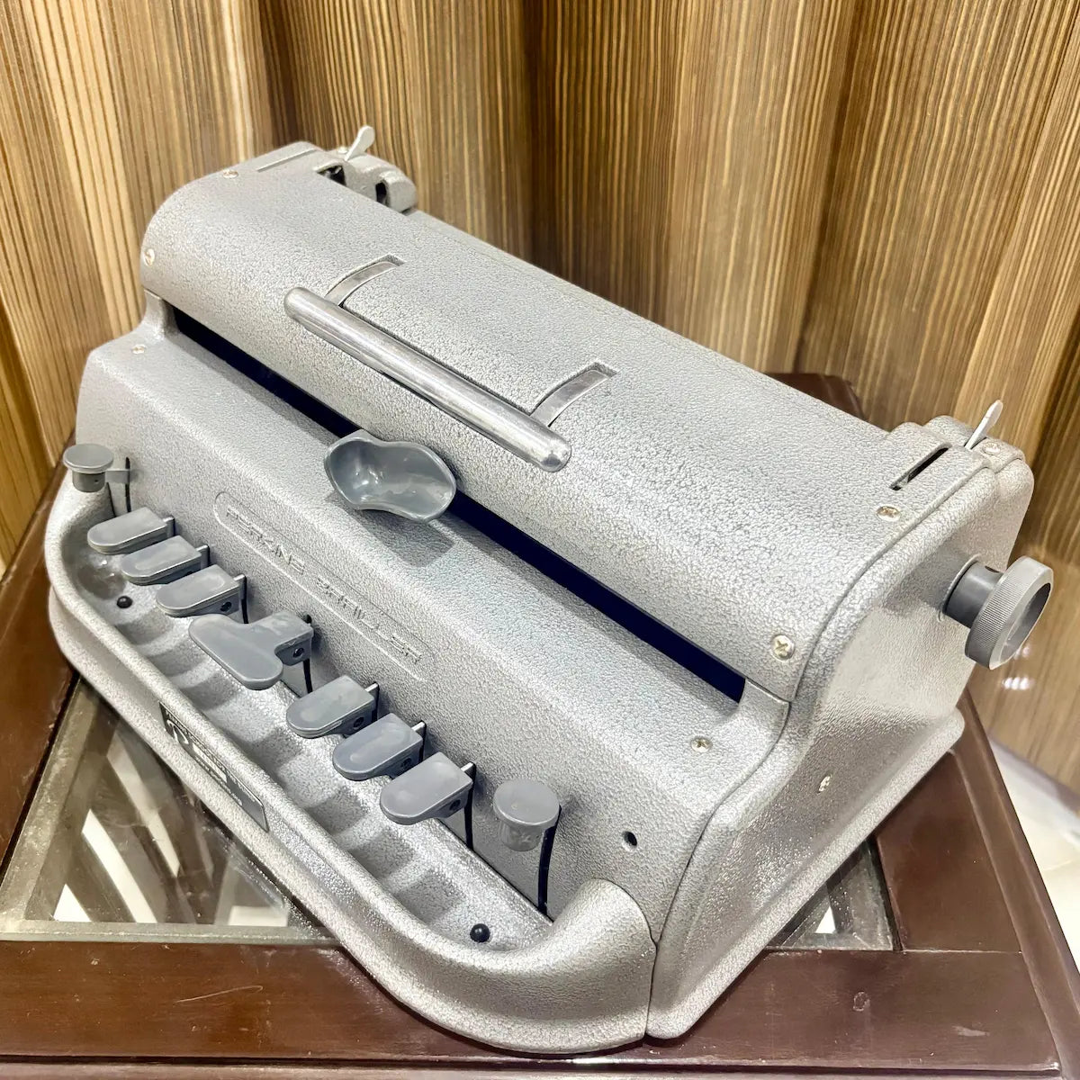 Underside view of the Perkins Brailler showing base construction and visible condition details at RR Typewriter Mart for Braille users.