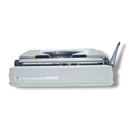 Side angle Hermes Baby typewriter, vintage typing machine with slim portable Swiss body design