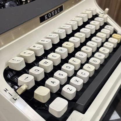 Buy a Kovac manual typewriter with original grey and ivory white finish, traditional typing mechanism and vintage appeal | RR Typewriter Mart