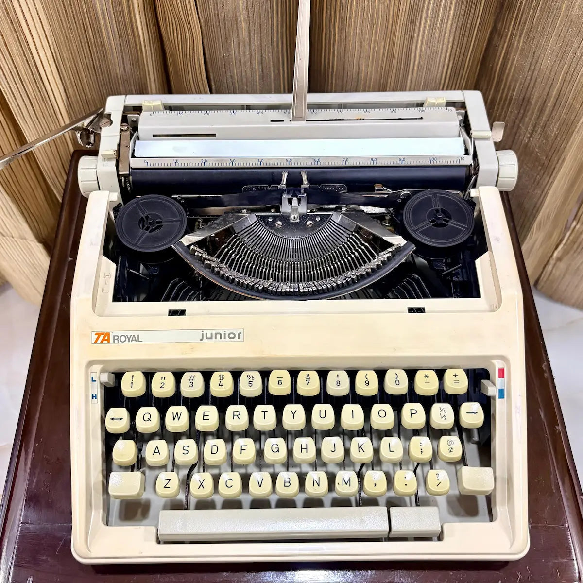 Royal Junior typewriter with carriage and typebars exposed, showing mechanical typing action, from RR Typewriter Mart.