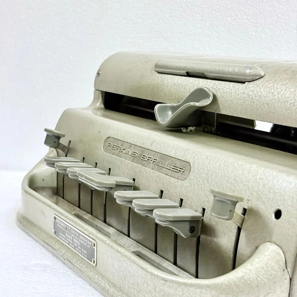 Braille Typewriter service for a Perkins Brailler in mint condition, preserving its original finish and mechanical operation at RR Typewriter Mart