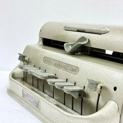 Braille Typewriter service for a Perkins Brailler in mint condition, preserving its original finish and mechanical operation at RR Typewriter Mart