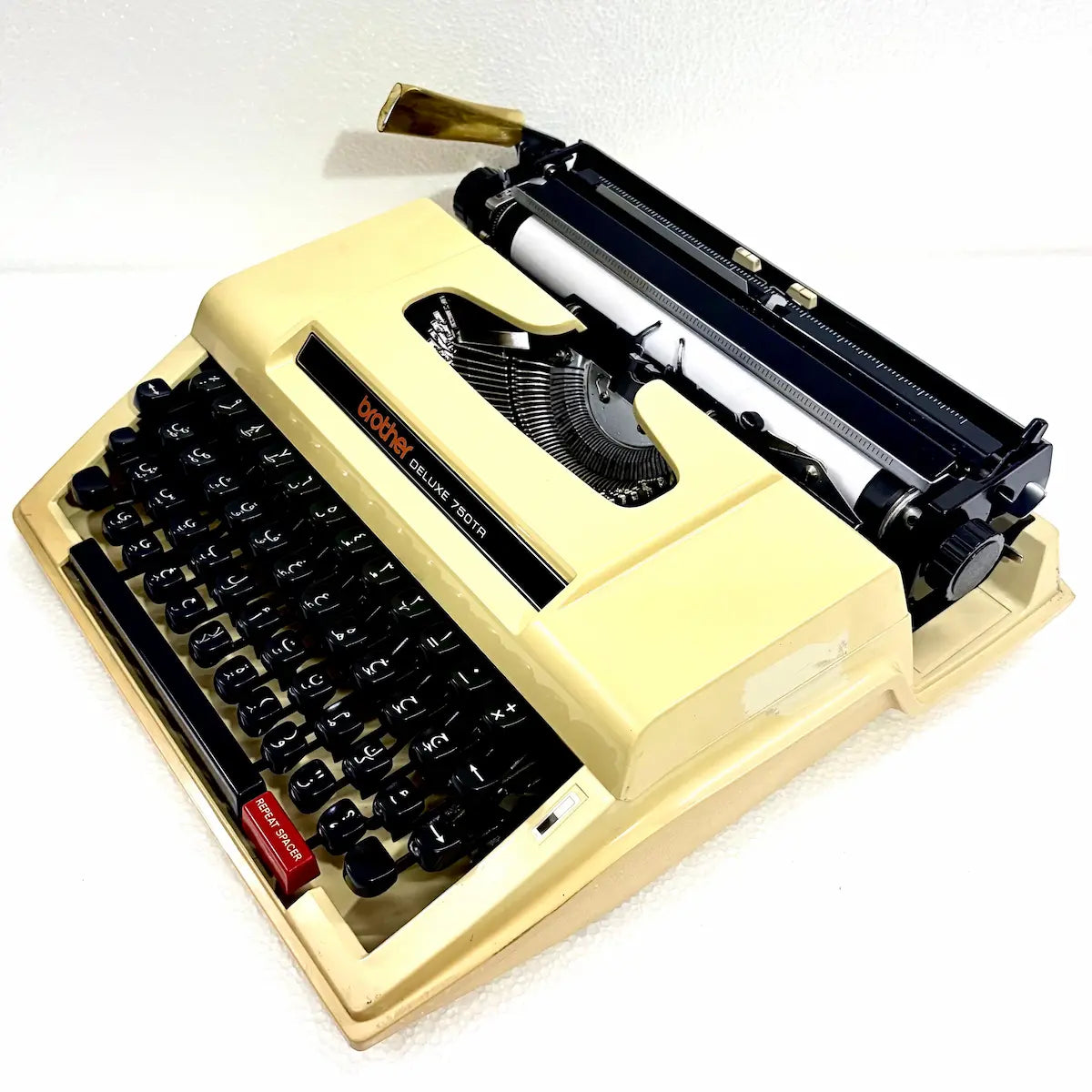 Brother 750TR Arabic typewriter available from RR Typewriter Mart, featuring Arabic keys and a distinctive cream portable body in India