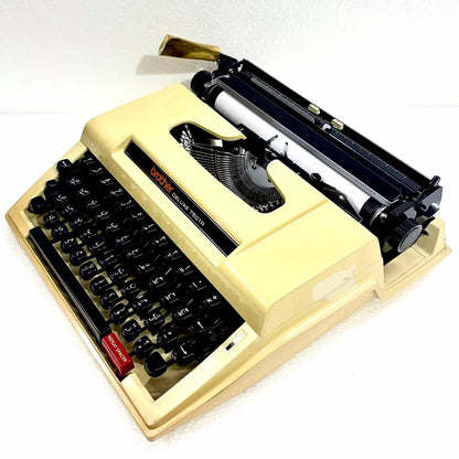 Brother 750TR Arabic typewriter available from RR Typewriter Mart, featuring Arabic keys and a distinctive cream portable body in India