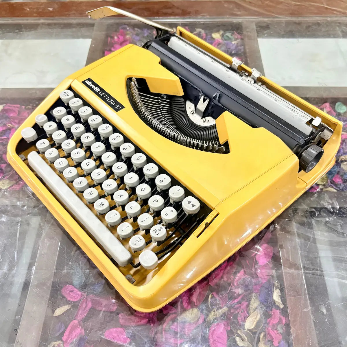 Detailed view of white keyboard on yellow Olivetti Lettera 82 typewriter at RR Typewriter Mart