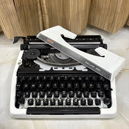Pearl White Brother Deluxe 220 typewriter, classic QWERTY portable mechanical typewriter available from RR Typewriter Mart India