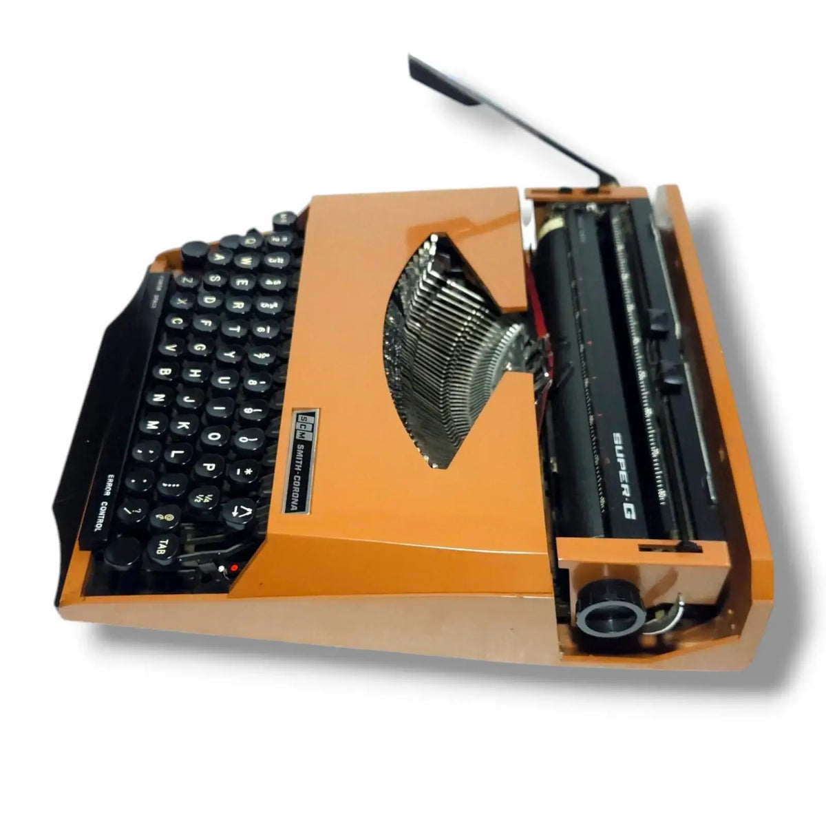 Portable imported typewriter with orange finish Smith Corona typing machine ready to type