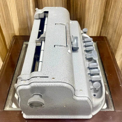Side view of the Perkins Braille Typewriter showing original metal casing and mechanical details at RR Typewriter Mart for Braille users.