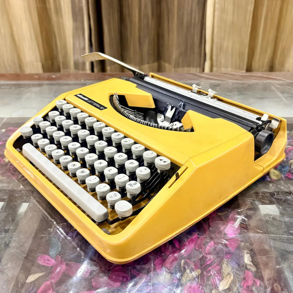 Side view of Olivetti Lettera 82 typewriter showing carriage, platen and casing at RR Typewriter Mart