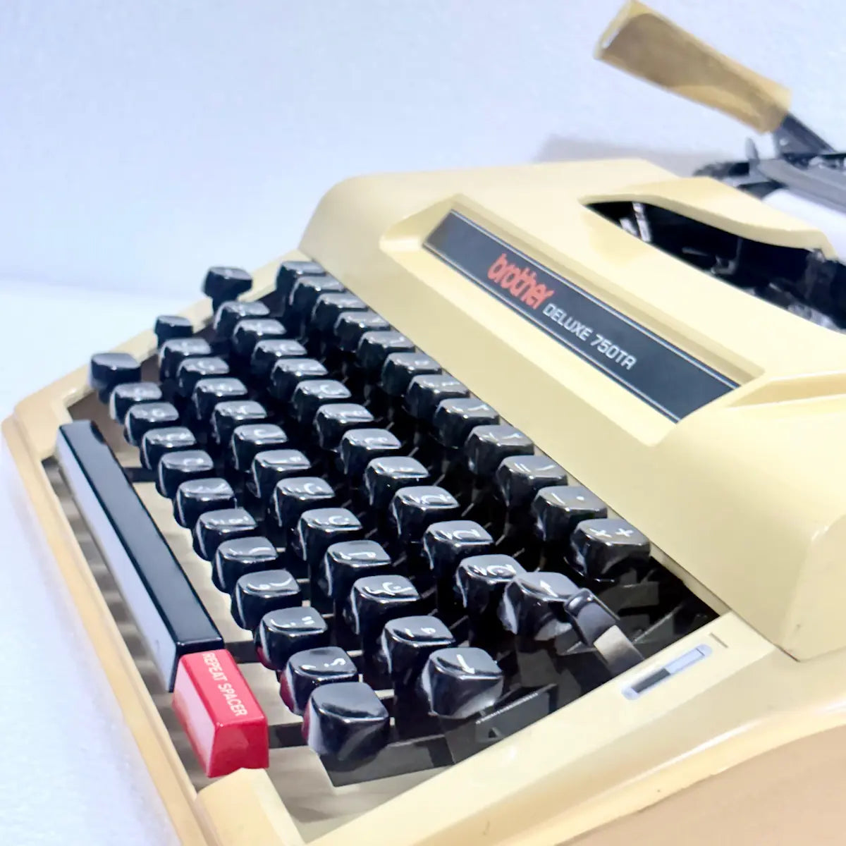 Brother Deluxe 750TR Arabic typewriter showing Arabic keyboard layout, mechanical typebars and classic portable construction for India