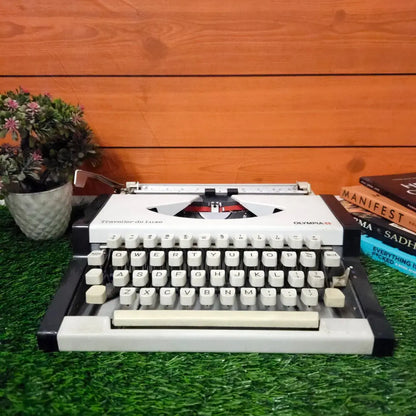 Brand New Olympia Traveller Deluxe Typewriter