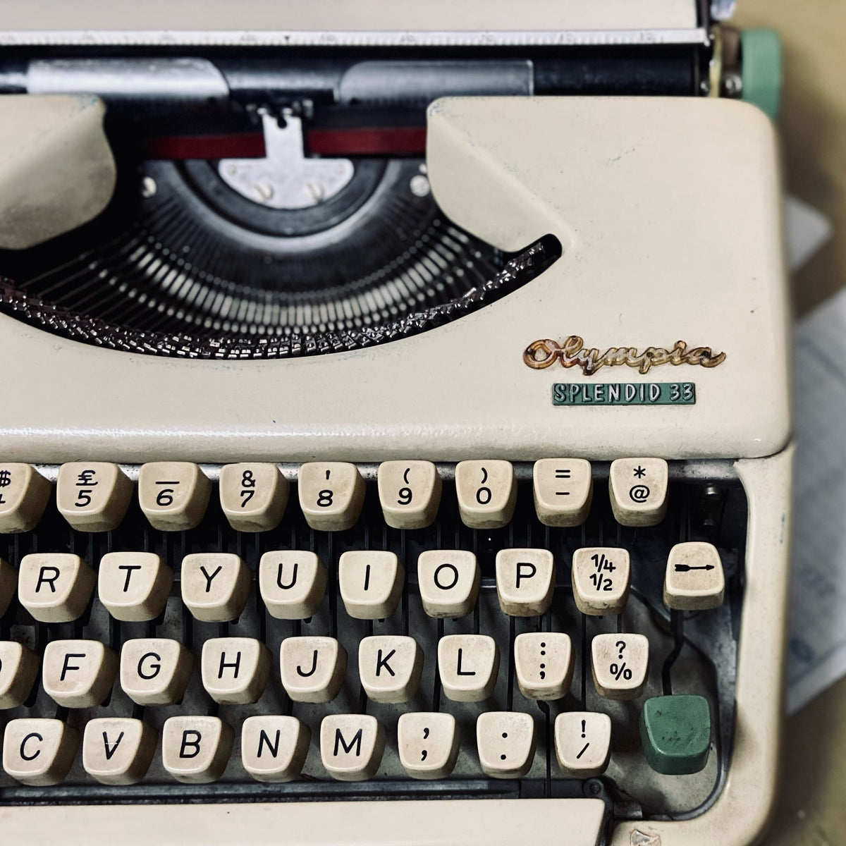 Olympia Splendid 33 portable typewriter close-up, vintage manual typing machine with QWERTY keyboard