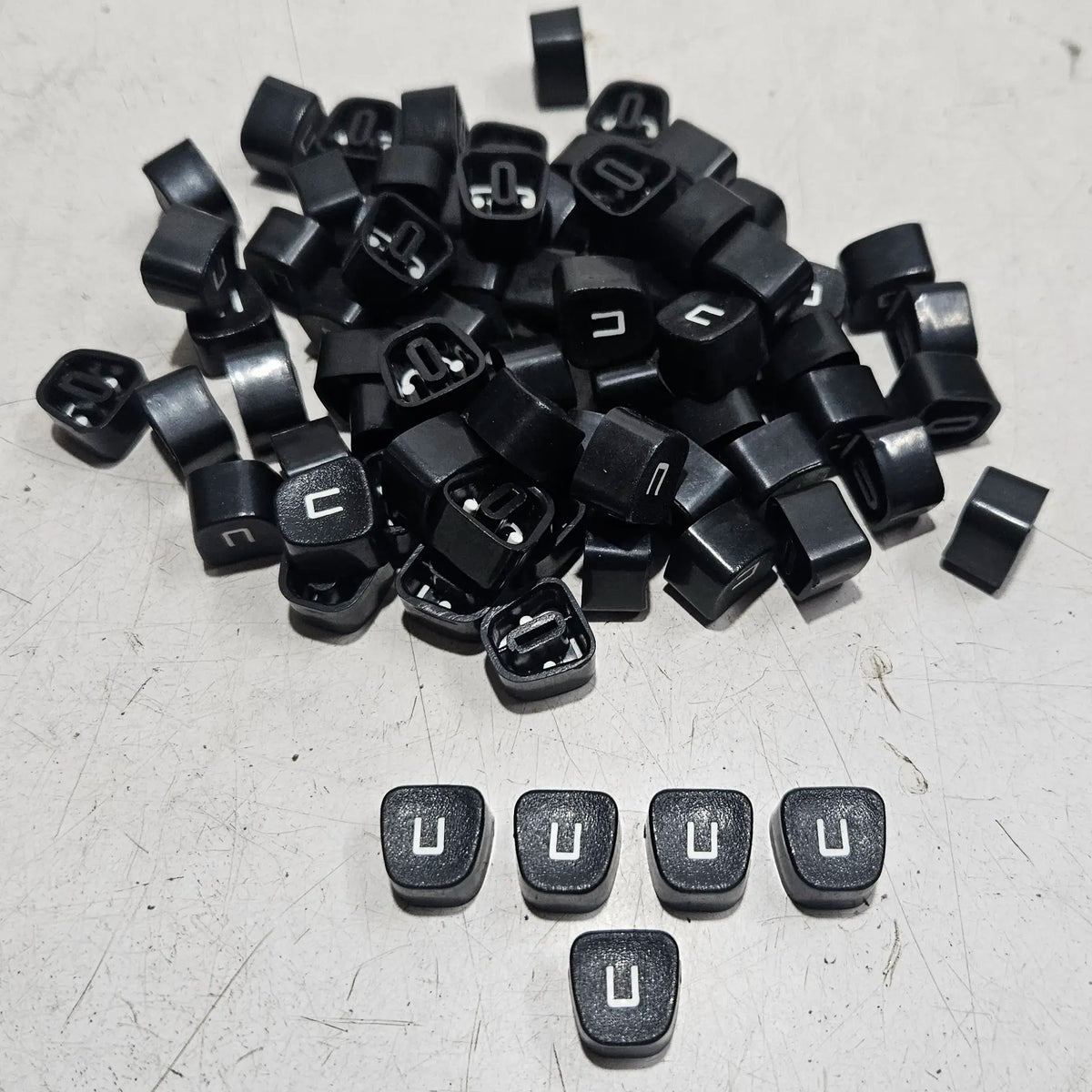 Replacement U keytops for manual typewriters, typewriter spare parts from RR Typewriter Mart collection