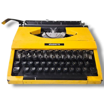 Bright yellow Silver Reed typewriter front view, Manual English Typewriter by RR Typewriter Mart seller