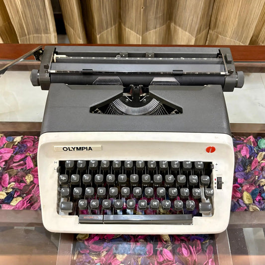 Front view of Olympia B12 manual portable typewriter with English keyboard and clean original finish
