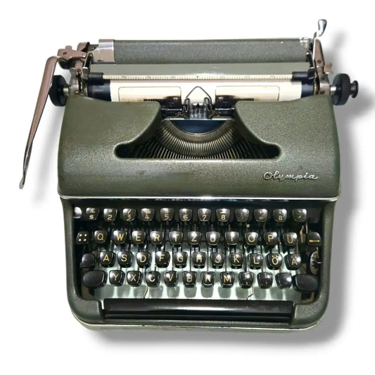 Front view olive green Olympia portable German typewriter, manual typing machine at RR Typewriter Mart India