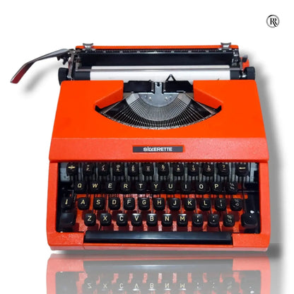 Front view of Silver Reed Silverette II Cosmic Orange portable manual English typewriter by RR Typewriter Mart