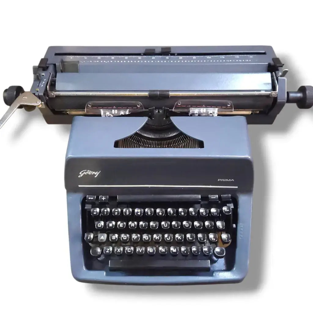 Godrej English typewriter front view with grey body, round black keys, manual typing machine by RR Typewriter Mart