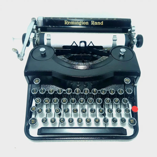 Remington Noiseless Model 1 black manual typewriter angled view with round keys, rare American vintage typing machine