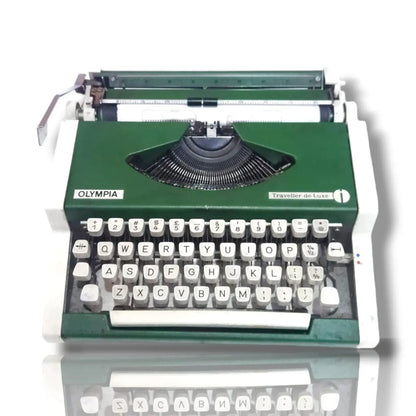Front view of Olympia German portable typewriter with English keyboard, classic green typing machine by RR Typewriter Mart