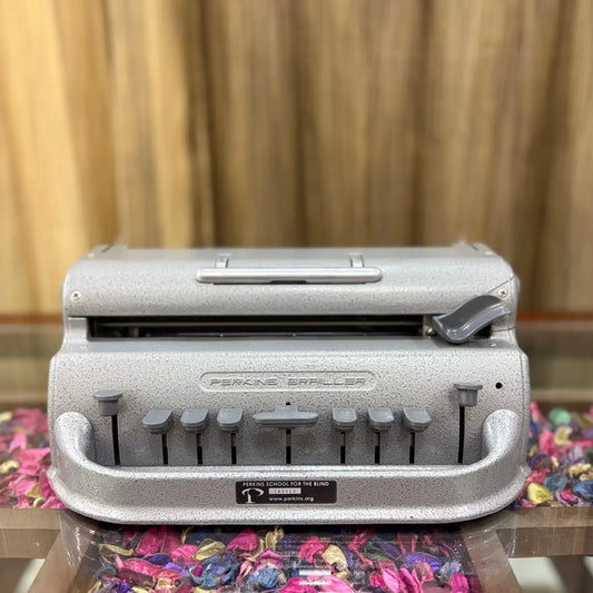 Front view of factory-sealed Perkins Braille Typewriter, manual Braille typing machine from RR Typewriter Mart