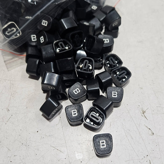 Close view of black Godrej B keytops used for typewriter restoration and typing machine maintenance work