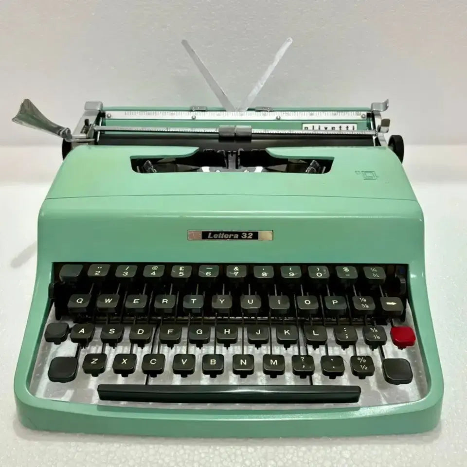 Mint green Olivetti typewriter front view, manual English typing machine by RR Typewriter Mart, buy typewriter Delhi store