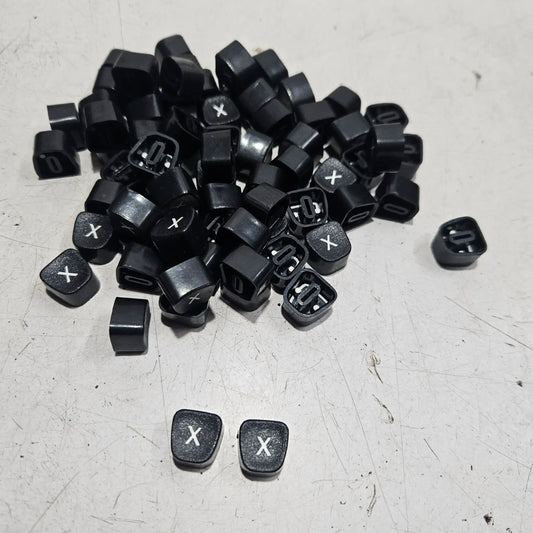 Replacement X keytops for manual typewriters, typing machine servicing parts and restoration components displayed