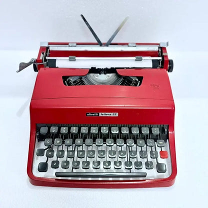 Top view of Olivetti Lettera 32 Rasso Red Typewriter with paper loaded and carriage visible, RR Typewriter Mart
