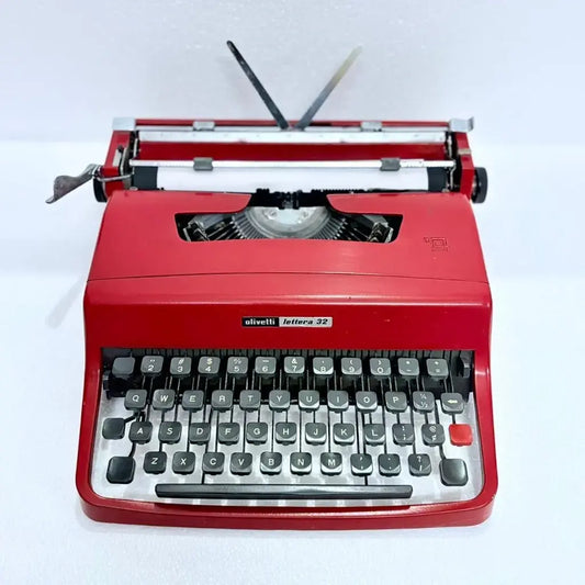 Top view of Olivetti Lettera 32 Rasso Red Typewriter with paper loaded and carriage visible, RR Typewriter Mart