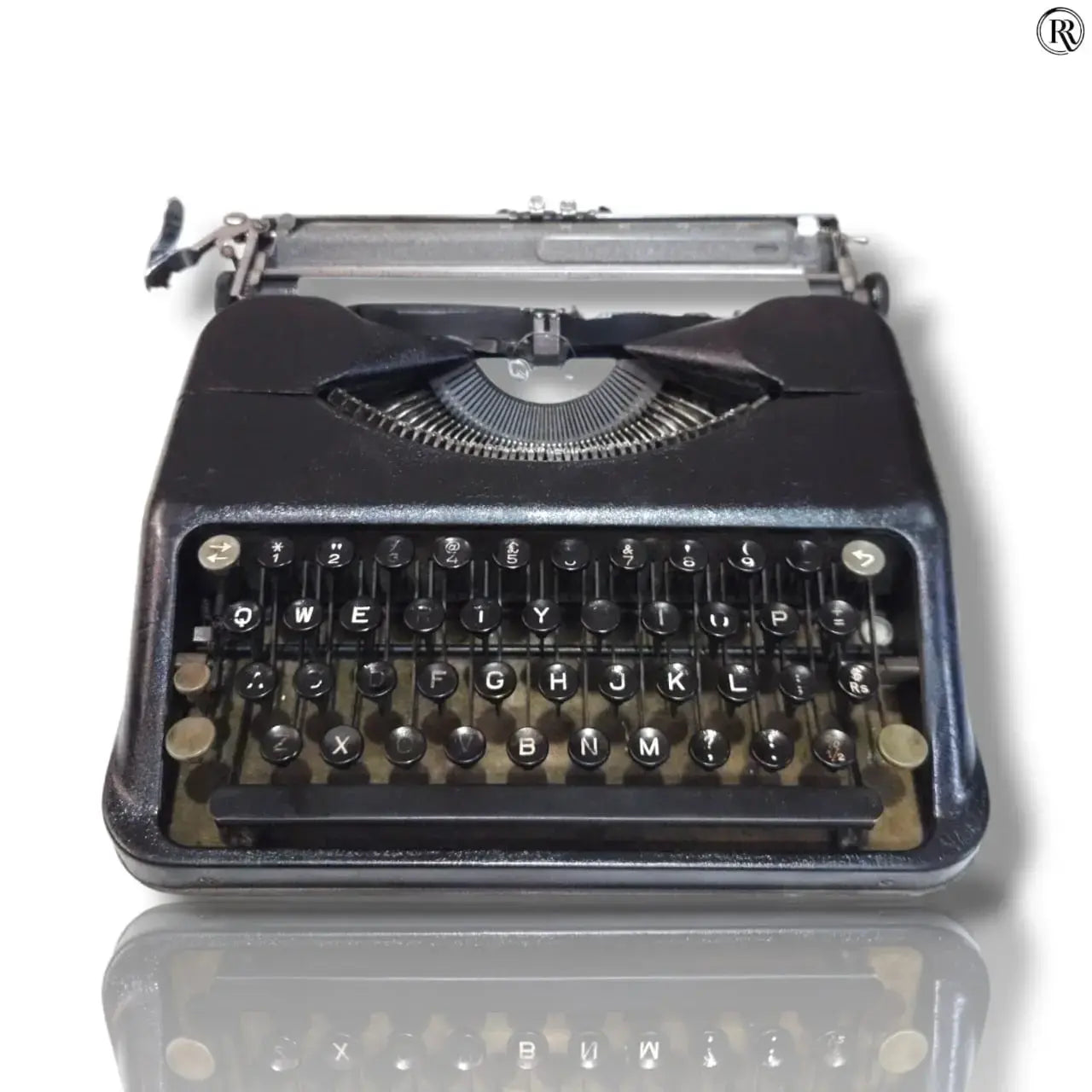 Black Hermes Baby typewriter front view, compact manual English typing machine with round keys at RR Typewriter Mart