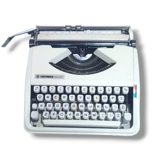 Hermes Baby typewriter in Arctic White, manual English typing machine from RR Typewriter Mart typewriter store