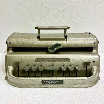 Original American-imported Perkins Braille Typewriter in gold-toned factory finish, a manual Braille writing machine from RR Typewriter Mart